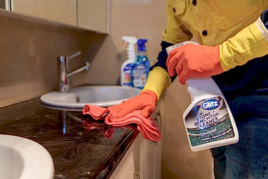 Perth cleaner scrubbing a laundry benchtop