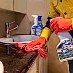 Perth cleaner scrubbing a laundry benchtop